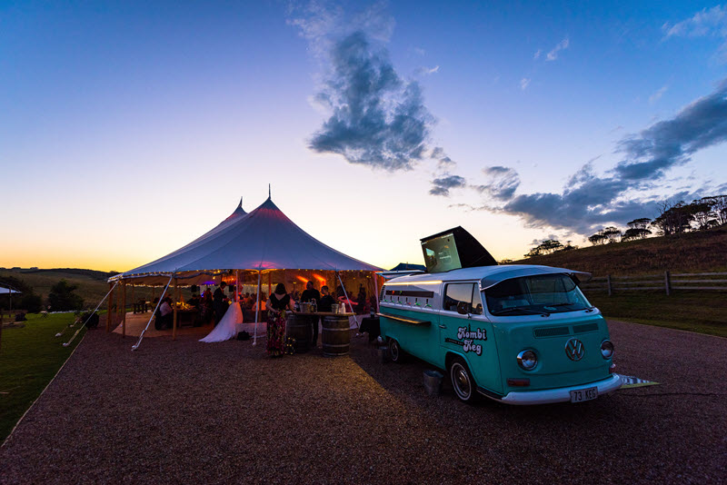 Sunset background with Kombi Keg mobile bar and marquee.