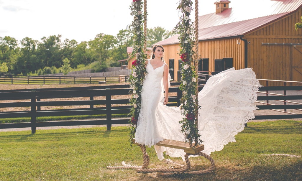 Canopy Creek Farm - Stunning Bride standing on a rope swing