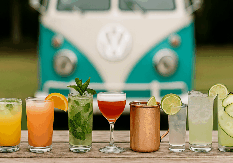 Ten tequila-based cocktails displayed on a wooden table